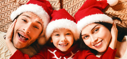 Image of family with santa hats on.