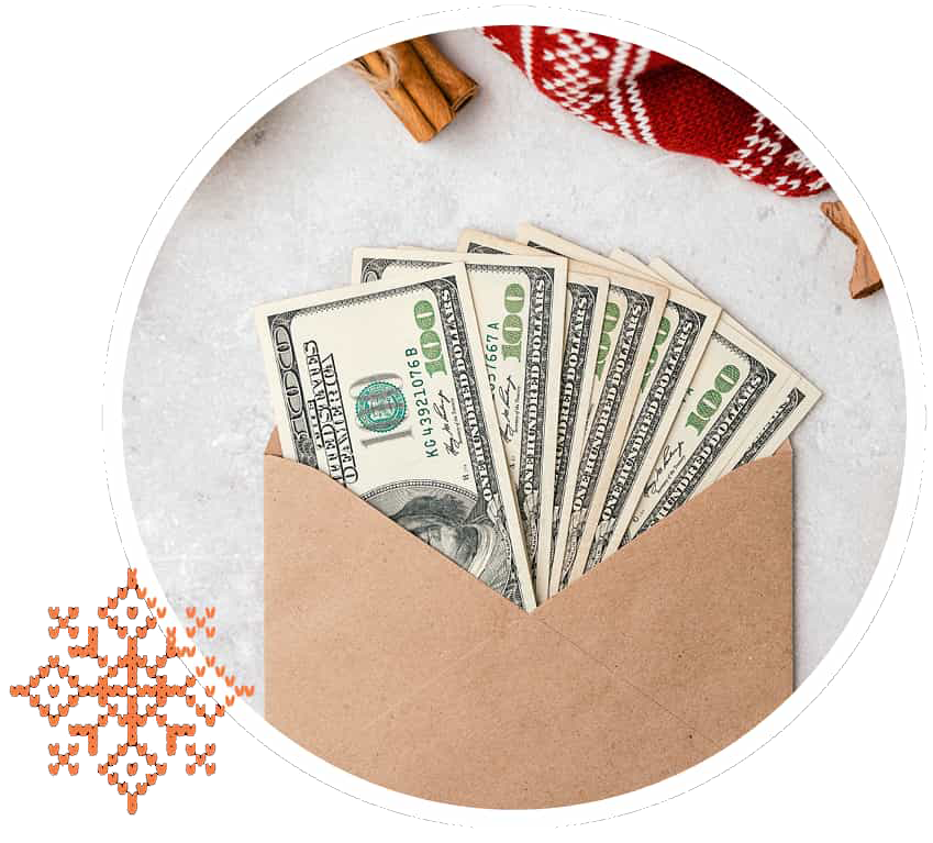 Image of money with christmas sweater next to it