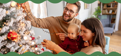 Image of family decorating a christmas tree for Christas Skip-A-Pay promotion.